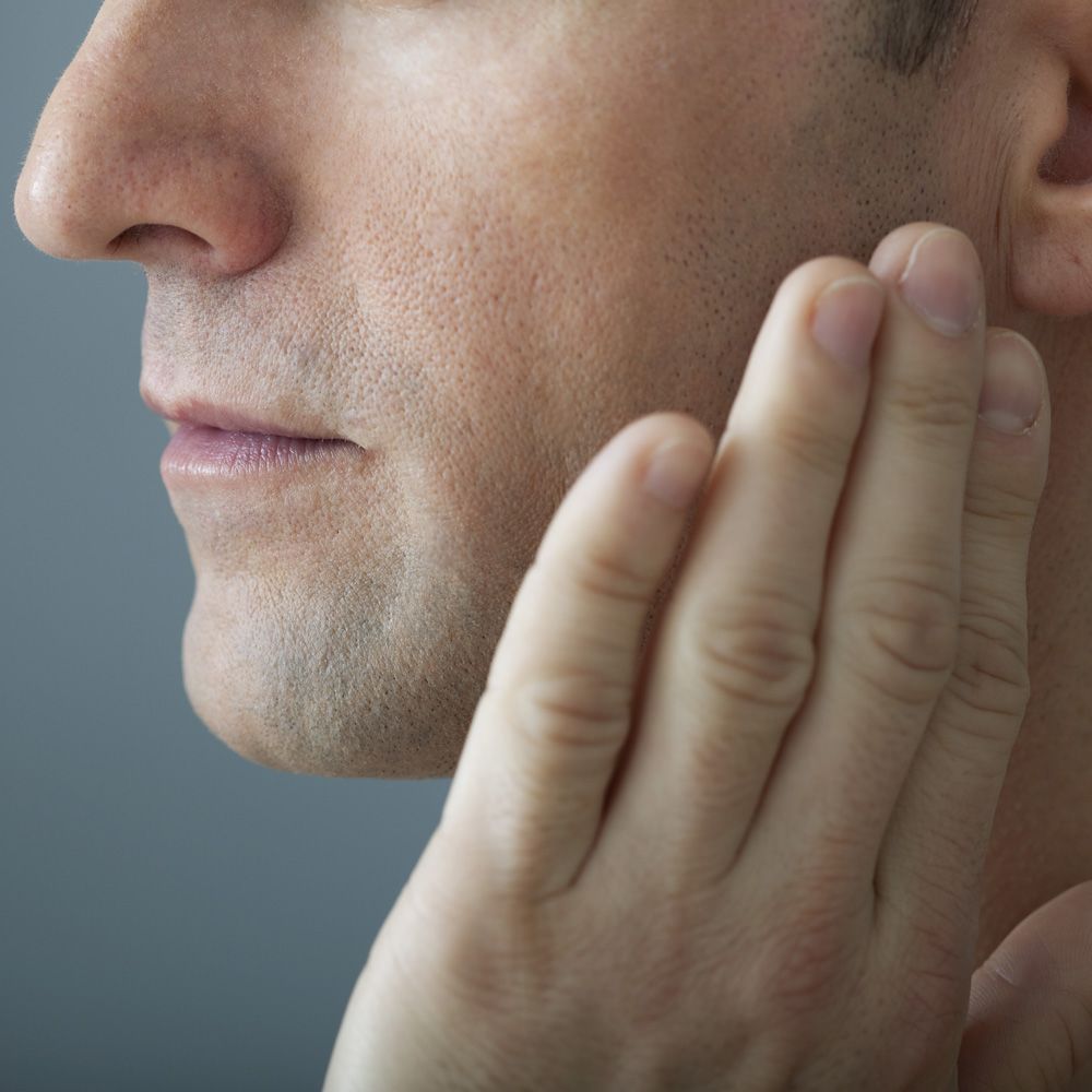 A man experiencing jaw pain
