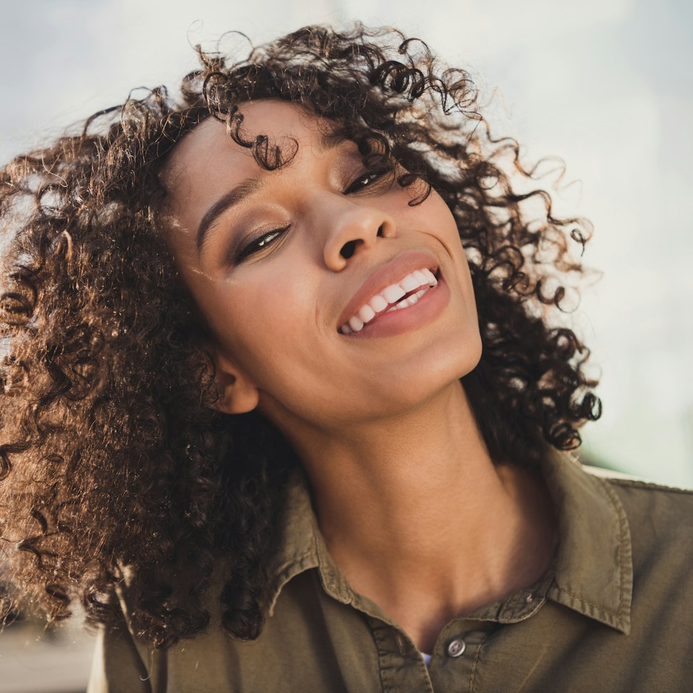 Smiling mature woman after cosmetic dentistry treatments