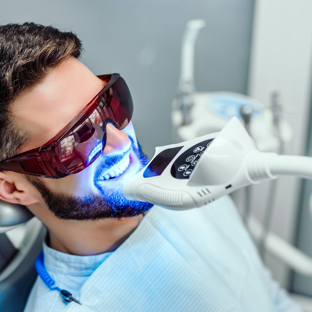 Man getting his teeth whitened